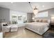 Relaxing main bedroom with window seat, accent lighting, and luxurious upholstered bed at 7952 Dante Dr, Littleton, CO 80125