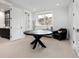 Bright office featuring a modern table desk and chair, next to a fully equipped wet bar area at 7952 Dante Dr, Littleton, CO 80125