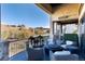 Expansive outdoor patio with a fire pit, comfortable seating, and stunning views of rolling hills at 7952 Dante Dr, Littleton, CO 80125
