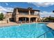 Beautiful community pool with comfortable lounge chairs and views of the clubhouse at 7952 Dante Dr, Littleton, CO 80125