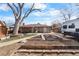 Large backyard with a fire pit and space to create a garden at 4713 Cody St, Wheat Ridge, CO 80033