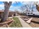 Wide backyard with firepit, garden beds, and ample parking at 4713 Cody St, Wheat Ridge, CO 80033