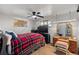 Bedroom with red plaid comforter and a ceiling fan at 4713 Cody St, Wheat Ridge, CO 80033