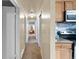 Hallway with carpet flooring, closet and an arched entryway at 4713 Cody St, Wheat Ridge, CO 80033