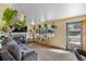 Inviting living room with cozy fireplace, neutral carpet, and abundant natural light at 4713 Cody St, Wheat Ridge, CO 80033