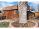 Outbuilding with planting space and tree at 4713 Cody St, Wheat Ridge, CO 80033