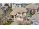 Aerial view of a two-story home with a tile roof, well-maintained yard, and two car garage in a suburban neighborhood at 19707 E 59Th Pl, Aurora, CO 80019
