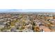 Expansive aerial view of a well-planned community with charming homes and picturesque mountain views at 19707 E 59Th Pl, Aurora, CO 80019