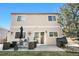 Back of home featuring a patio area with a grill, furniture, and access to a well-kept lawn at 19707 E 59Th Pl, Aurora, CO 80019