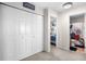 Hallway with a double door closet gives access to a bedroom and bathroom at 19707 E 59Th Pl, Aurora, CO 80019