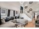 Spacious living room with high ceilings, natural light, and a modern staircase, perfect for Gathering gatherings at 19707 E 59Th Pl, Aurora, CO 80019