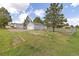 Spacious backyard with a detached garage and chain link fence at 762 S Paddock St, Elizabeth, CO 80107