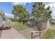 Well-kept backyard with a quaint patio and mature trees, offering a serene outdoor retreat at 762 S Paddock St, Elizabeth, CO 80107