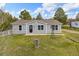 Charming single-story home featuring a well-maintained lawn and a decorative windmill at 762 S Paddock St, Elizabeth, CO 80107