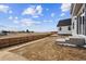 Expansive backyard featuring new landscaping and a wooden fence, perfect for outdoor enjoyment at 190 Lark Sparrow Way, Bennett, CO 80102