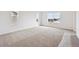 Spacious bedroom with ample natural light, featuring plush carpeting and neutral tones for a serene retreat at 190 Lark Sparrow Way, Bennett, CO 80102