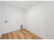 Functional laundry room with light wood floors, ready for appliances, perfect for easy chore management at 190 Lark Sparrow Way, Bennett, CO 80102