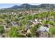 Breathtaking aerial view of a charming neighborhood nestled beneath majestic mountains at 2255 18Th St, Boulder, CO 80302