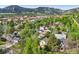 Breathtaking aerial view of the property nestled among lush greenery and with the majestic mountains beyond at 2255 18Th St, Boulder, CO 80302
