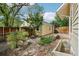 Inviting backyard with stone pathway, detached garage, and garden area, creating a serene outdoor space at 2255 18Th St, Boulder, CO 80302