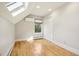 Bright bedroom with a skylight, hardwood floors, and a modern air conditioning unit at 2255 18Th St, Boulder, CO 80302