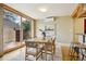 Bright dining area with hardwood floors, modern table set, and sliding glass door at 2255 18Th St, Boulder, CO 80302