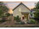 Inviting home with red door, porch swing, and well-manicured landscaping, offering a warm welcome at 2255 18Th St, Boulder, CO 80302