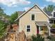 Charming home with a red door, inviting front porch swing, and lush landscaping creating curb appeal at 2255 18Th St, Boulder, CO 80302