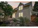 Charming home featuring stone patio, mature landscaping, and beautiful sunset sky at 2255 18Th St, Boulder, CO 80302