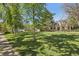 Large front yard offering ample green space and picturesque views of the inviting residence at 2255 18Th St, Boulder, CO 80302