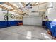 Well-organized garage with ample storage, shelving, and high ceilings, ideal for hobbyists and car enthusiasts at 2255 18Th St, Boulder, CO 80302