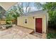 Detached garage features a red door and concrete pad, providing a convenient and stylish parking solution at 2255 18Th St, Boulder, CO 80302
