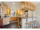 Well-lit kitchen with warm-toned cabinetry, granite countertops, and stainless steel appliances at 2255 18Th St, Boulder, CO 80302