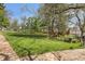 Spacious lawn area providing a serene outdoor space with seating and mature trees at 2255 18Th St, Boulder, CO 80302