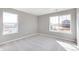 Bedroom with two windows and carpet at 18344 Prince Hill Cir, Parker, CO 80134