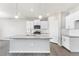 Modern kitchen with white cabinets, stainless steel appliances, and an island at 18344 Prince Hill Cir, Parker, CO 80134