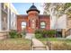 Charming brick home with a unique turret, complemented by a well-maintained front yard and inviting entryway at 2914 W 29Th Ave, Denver, CO 80211