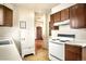 View of the cozy kitchen with the refrigerator and stove at 2914 W 29Th Ave, Denver, CO 80211