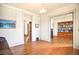 Sunlit room featuring hardwood floors with views into adjacent room with built-in bookshelf at 2914 W 29Th Ave, Denver, CO 80211