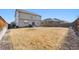 Wide view of the backyard featuring wood fencing and low maintenance landscaping at 13673 Valentia St, Thornton, CO 80602