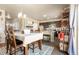 Open-concept dining room adjacent to the kitchen, perfect for Gathering meals and entertaining guests at 13673 Valentia St, Thornton, CO 80602