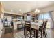 Inviting dining area featuring a table with seating and a view of the backyard through sliding glass doors at 13673 Valentia St, Thornton, CO 80602