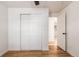 Light and airy bedroom featuring wood floors and a large closet at 11082 Callaway Rd, Parker, CO 80138