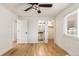 Bright bedroom with hardwood floors and ceiling fan at 11082 Callaway Rd, Parker, CO 80138