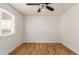 Well-lit bedroom with hardwood floors and window coverings at 11082 Callaway Rd, Parker, CO 80138