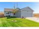Ranch style home with attached garage and landscaped lawn at 11082 Callaway Rd, Parker, CO 80138