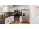Modern kitchen featuring stainless steel appliances and granite countertops at 11082 Callaway Rd, Parker, CO 80138