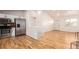 Open living area with hardwood floors and kitchen access at 11082 Callaway Rd, Parker, CO 80138