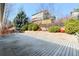 Large backyard deck with privacy landscaping and view of the house at 10273 Nottingham Dr, Parker, CO 80134