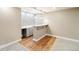 Finished basement wet bar with granite counters, modern cabinets, and stone accent wall at 10273 Nottingham Dr, Parker, CO 80134